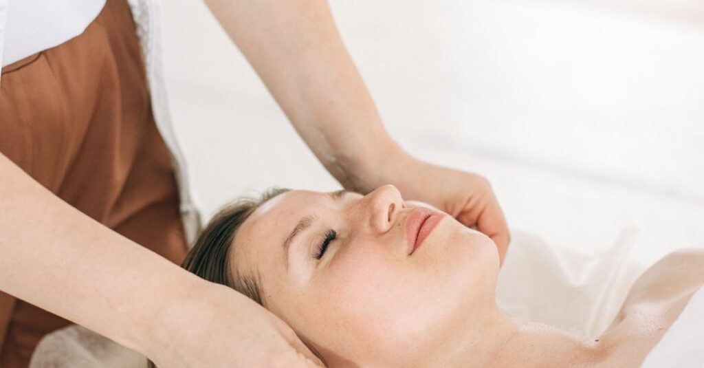 A Person Massaging Woman's Face